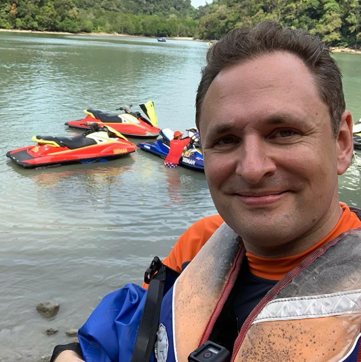 Michael C. Short on location by the water during field operations